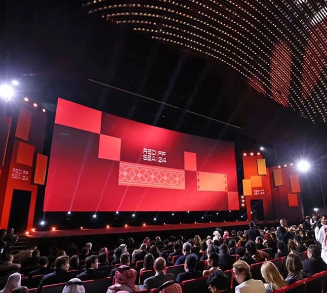 Red Sea International Film Festival — Audience seated before a large red cinema stage